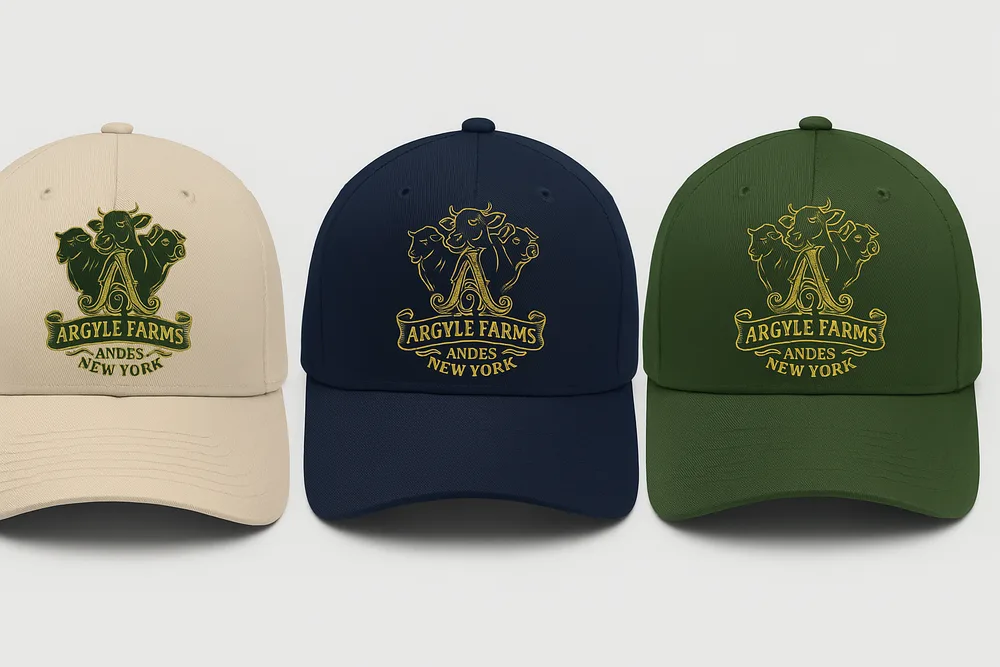 The Argyle Farms crest cap shown in black, sand, navy, and forest colorways