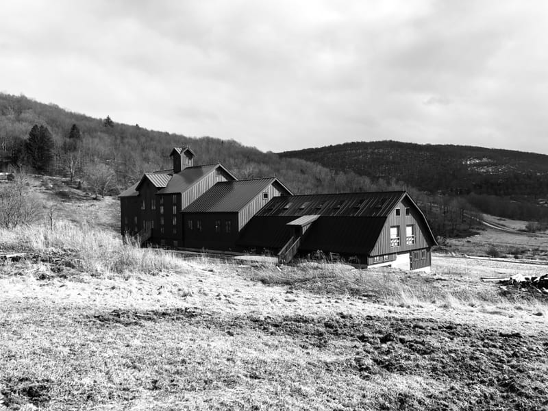 The farmhouse and barn against the Catskill hills, black and white